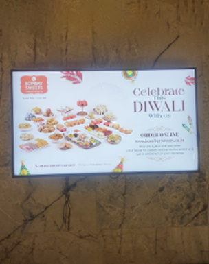 Digital signage display in Bombay sweets shop